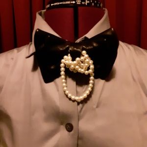 Unique leather and pearl bowtie.